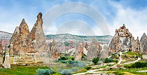 Wonderful landscape with ancient church at Cappadocia, Anatolia, Turkey. Volcanic mountains in Goreme national park.