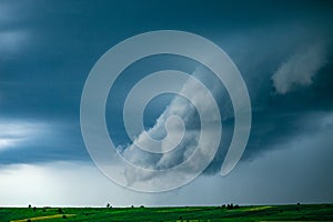 Wonderful landscape of dark cloud sky before rain. Picturesque background of a farmlands and cloudy sky