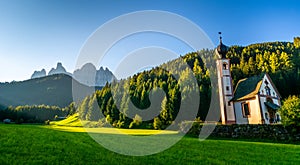 Wonderful landscape of Dolomite Alps during sunset. St Johann Church, Santa Maddalena, Val Di Funes, Dolomites, Italy. Amazing