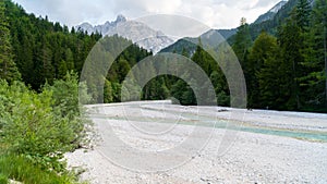 Wonderful landscape of Triglav National Park in sunny day. Majestic Mangart Mount near Jasna lake. Wild area. Julian