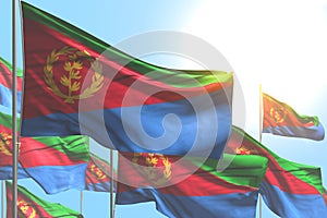 Wonderful many Eritrea flags are waving on blue sky background - any holiday flag 3d illustration