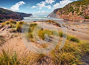 Wonderful morning view of Cala Domestica beach. Stunning summer scene of Sardinia, Italy,