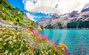 Wonderful morning view of Fedaia lake. Attractive summer scene of Dolomiti Alps, Gran Poz location, Trentino-Alto Adige/Sudtirol r
