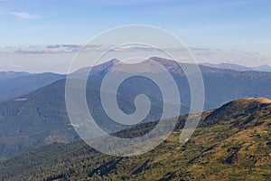 Wonderful panoramic view of Carpathians mountains, Ukraine. Mount Hoverla, Carpathians. Evergreen hills landscape with clear sky.