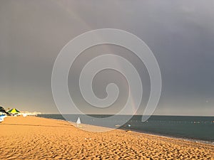 Wonderful rainbow over the sea and the beach in Turkey after heavy rain