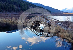 Wonderful reflections of a bridge and the sky in the Kootenays