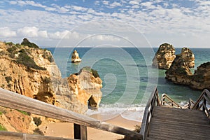 Wonderful seas caves on sandy camilo beach, algarve, portugal