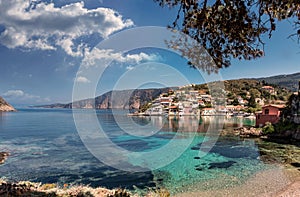 Wonderful summer seascape of Ionian Sea. Wonderful place for holiday. Amazing Greece. Picturesque colorful village Assos in