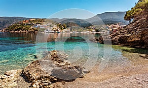 Wonderful summer seascape of Ionian Sea. Wonderful place for holiday. Amazing Greece. Picturesque colorful village Assos in