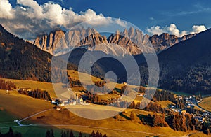 Wonderful Sunny Landscape of Dolomite Alps. Beautiful view of Santa Maddalena village at sunset in front of the Geisler or Odle