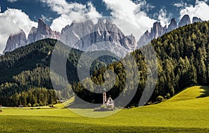 Wonderful Sunny Landscape of Dolomite Alps. St Johann Church, Santa Maddalena, Val Di Funes, Dolomites, Italy. Fairy velley in