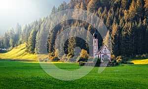 Wonderful Sunny Landscape of Dolomite Alps. St Johann Church, Santa Maddalena, Val Di Funes, Dolomites, Italy. Fairy velley in