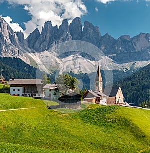 Wonderful Sunny Landscape of Dolomite Alps. St Johann Church, Santa Maddalena, Val Di Funes, Dolomites, Italy. Fairy velley in