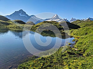 Wonderful sunrise at the Bachsee above Grindelwald. Fantastic views of the mountains and glaciers. Fiescherhorn. Lake