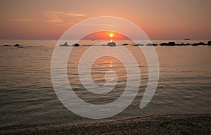 Wonderful sunrise in the beach of Sirolo, Marche, Italy photo