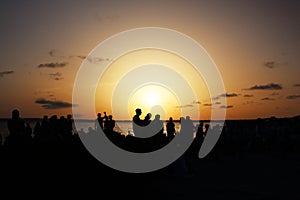 Wonderful sunset celebrated by many people at Pirata Bus Bar in Formentera, BalearicIslands, Spain photo