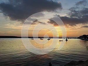 wonderful sunset in croatia with boats in the middle