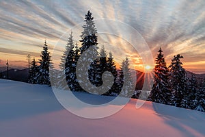 Wonderful sunset with snow and beautiful clouds