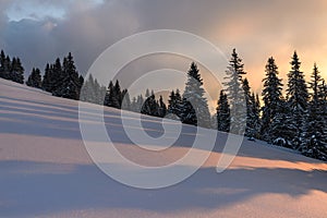 Wonderful sunset with snow and beautiful clouds