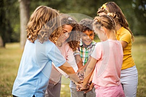 Wonderful team. Large group of school kids having fun in nature