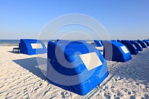 Blue Beach Cabanas on a White Sand Tropical Beach