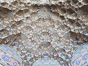 A wonderful view of the decorations on the colored tiles of the beautiful dome in Shiraz
