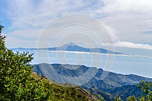 Wonderful views of the island of Tenerife and the Teide from the viewpoint of the Laja in the haze of the summits in La Gomera.