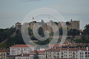 Wonderful views of the Medieval Castle of San Jorge from the San Pedro de Alcantara Garden in Lisbon. Nature, architecture,