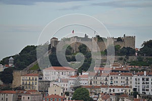 Wonderful views of the Medieval Castle of San Jorge from the San Pedro de Alcantara Garden in Lisbon. Nature, architecture,