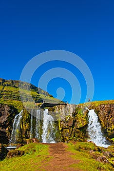 Wonderful waterfal Kirkjufellsfoss in Iceland in Autumn colors