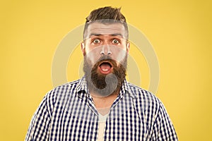Wondering every time. Man bearded hipster wondering face yellow background close up. Guy surprised face expression