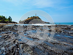 a wondrous place, the back stone and lighthouse in background.