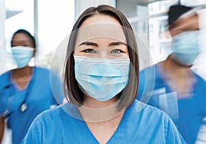 We wont get through this without dedicated frontline healthcare workers. Portrait of a doctor wearing a face mask in a