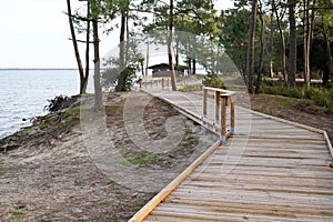 Wood access beach pathway lake view wooden path terrace in Maubuisson Carcans France