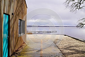 Wood access empty pontoon sand beach on Lake Hourtin in Gironde france