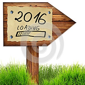 Wood arrow sign with 2016 loading handwritten on old page of pap