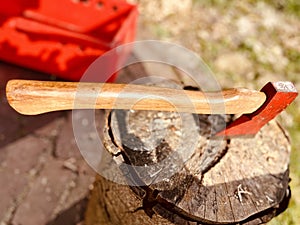 Wood axe for chopping wood, hammered into the wood stump after work is done