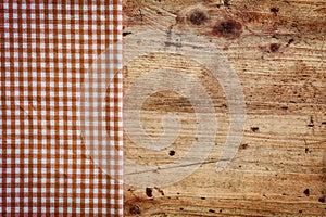 Wood background with checked napkin