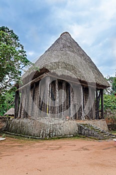 Wood and bamboo temple called Achum at traditional Fon`s palace in Bafut, Cameroon, Africa photo