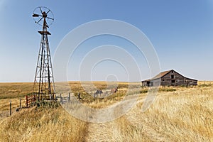 Wood barns, stables and windmill in North dakota countryside