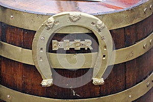 Wood beer keg with horseshoe