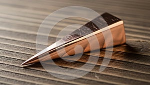 Wood beneath has a distinct grain pattern enhancing the contrast