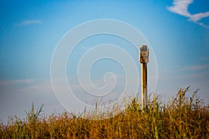 Wood bird house beach grass sunset