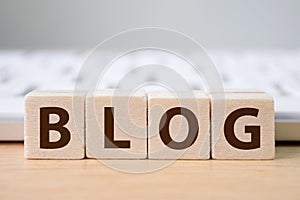 Wood block cube put the front computer keyboard with word BLOG and empty copy space for your text