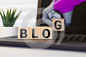 Wood block cube put the front computer keyboard with word BLOG