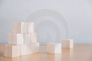 Wood block stacking as step stair. Business concept for growth succeeding