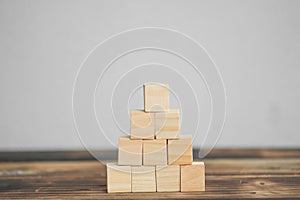 Wood block stacking as step stair and coins stacked, business growth to success.