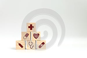 Wood block stacking with icon healthcare medical on white background