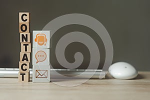 Wood block symbol call center, chat and mail address. Website page contact us or e-mail marketing concept