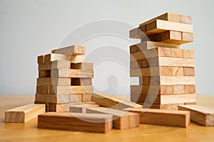 Wood block tower with architecture model, Concept Risk of management and strategy plan, growth business success process